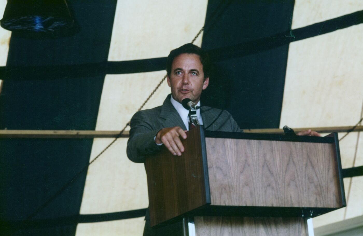 Morton H. Meyerson speaking at a podium in 1979, the year he was named president of Electronic Data Systems